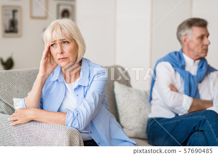 Sad senior woman after arguing with husband Sad senior woman after arguing with husband 57690485