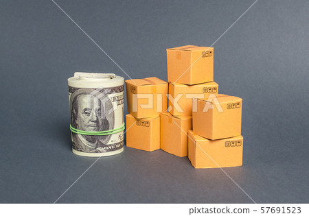 Roll of dollars and cardboard boxes. Business and industry. The concept of commerce and trade. retail and distribution. Performance efficient production. Production and export of products and goods. Roll of dollars and cardboard boxes. Business and industry. The concept of commerce and trade. retail and distribution. Performance efficient production. Production and export of products and goods. 57691523