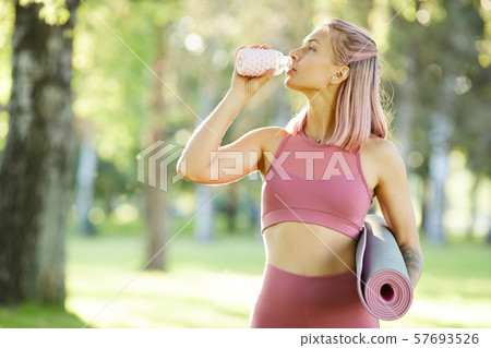 Fit woman after sports training Fit woman after sports training 57693526