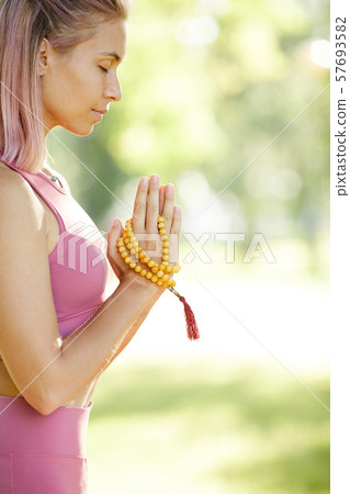 Woman relaxing during yoga Woman relaxing during yoga 57693582