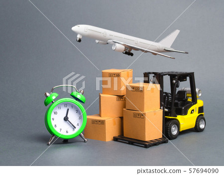 Yellow Forklift truck with cardboard boxes, a airmail plane and a alarm clock. Express delivery concept. Temporary storage, limited offer and discount. Optimization of logistics. Distribution 57694090