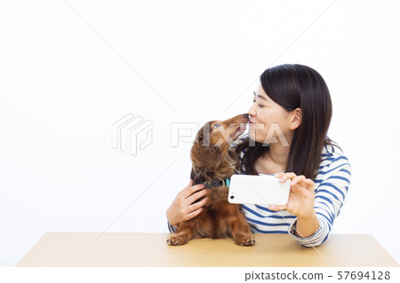 30s female and miniature dachshund 57694128