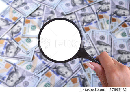 concept of Health insurance. magnifier against the background of Many dollar banknotes concept of Health insurance. magnifier against the background of Many dollar banknotes 57695482