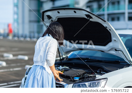 Troubled car woman driving trouble 57695722