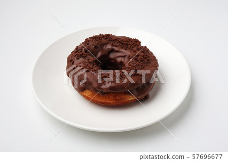 Chocolate donuts on a plate white background 57696677