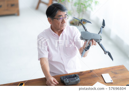 Drone controller 1 person hobby work home business old man old age interior design room Drone controller 1 person hobby work home business old man old age interior design room 57696804