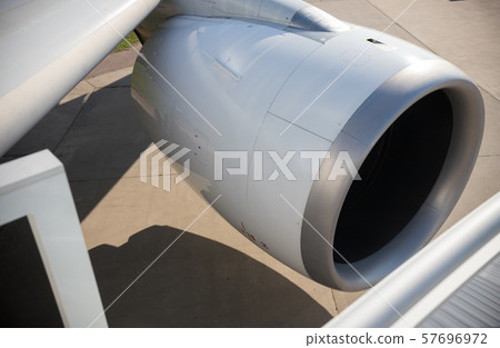 White turbine of an airplane on the wing of the plane White turbine of an airplane on the wing of the plane 57696972