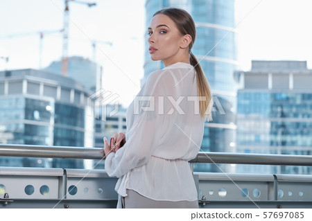 Young businesswoman (real estate agent) presenting 57697085