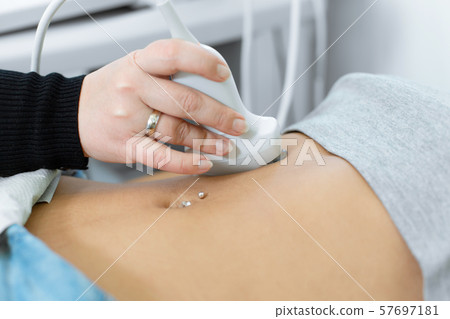 The doctor is preparing to conduct ultrasound The doctor is preparing to conduct ultrasound 57697181