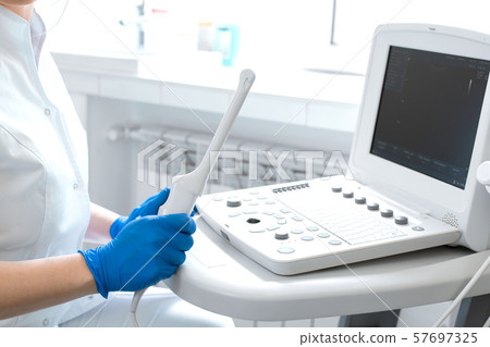 the gynecologist holds the sensor for vaginal 57697325