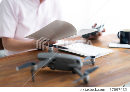 Drone controller 1 person hobby work home business old man old age interior design room 57697483