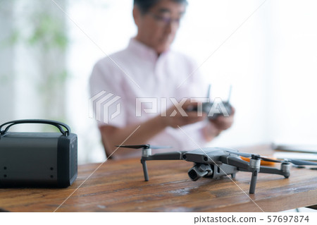 Drone controller 1 person hobby work home business old man old age interior design room 57697874