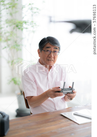 Drone controller 1 person hobby work home business old man old age interior design room 57698113