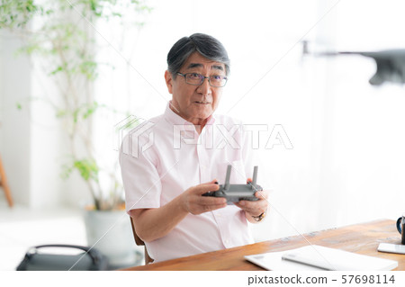 Drone controller 1 person hobby work home business old man old age interior design room 57698114