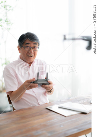 Drone controller 1 person hobby work home business old man old age interior design room 57698115