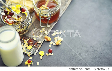 Healthy breakfast. Muesli from cereals with milk berries. 57698723