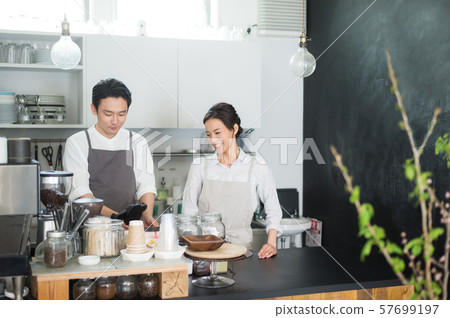Cafe staff men and women Cafe staff men and women 57699197