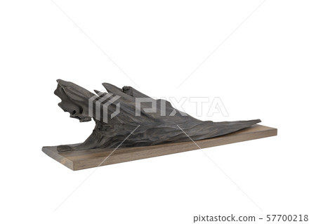 Carved sculpture of bog oak on a white background. 57700218