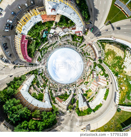 Aerial city view with crossroads and roads, houses, buildings, parks and parking lots. Sunny summer 57701280