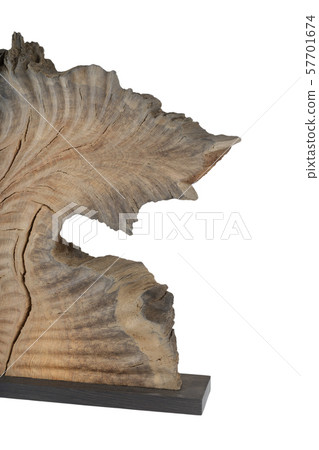 Carved sculpture of bog oak on a white background. Carved sculpture of bog oak on a white background. 57701674