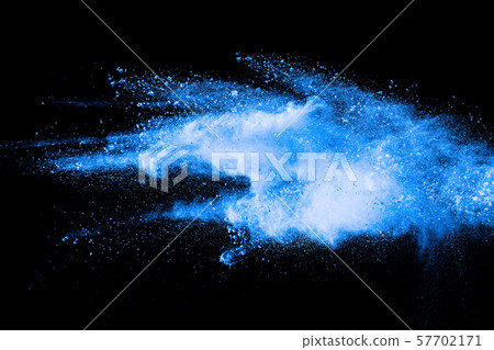 Blue color powder explosion cloud on black background.Closeup of Blue dust particles exhale on dark background. 57702171