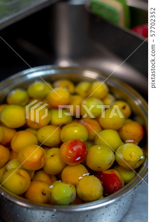 Plum juice making Plum juice making 57702352
