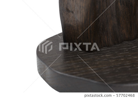 Carved sculpture of bog oak on a white background. Carved sculpture of bog oak on a white background. 57702468