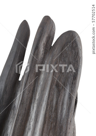 Carved sculpture of bog oak on a white background. 57702514