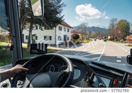 View through the driver's window of a bus 57702760