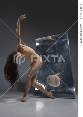 Young and stylish modern ballet dancer on grey background 57704401