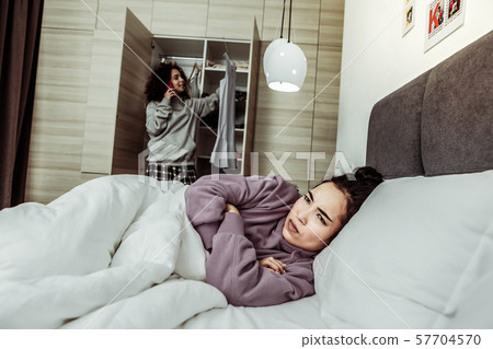 Young woman being mad at her roommate Young woman being mad at her roommate 57704570