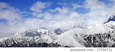 Snow winter mountains in clouds Snow winter mountains in clouds 57704712
