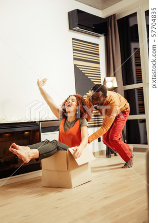 Cheerful young people having fun during removal 57704835