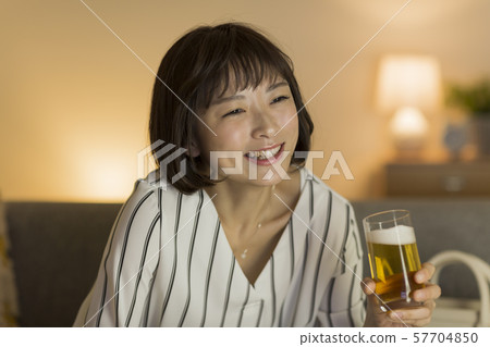 Young woman with beer Young woman with beer 57704850