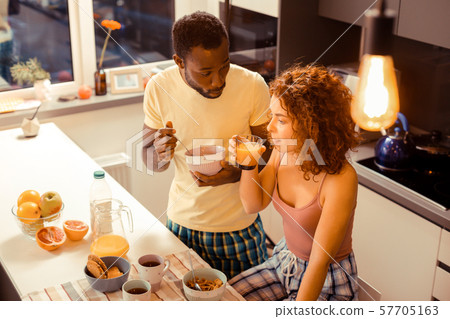 Emotional dark-skinned male person talking to his partner Emotional dark-skinned male person talking to his partner 57705163