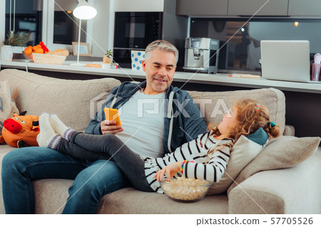 Happy male person communicating with his child Happy male person communicating with his child 57705526