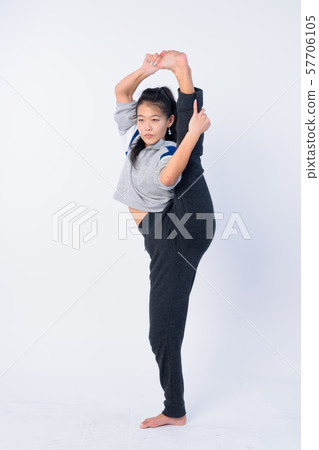 Full body shot of beautiful Asian woman stretching and ready for gym Full body shot of beautiful Asian woman stretching and ready for gym 57706105