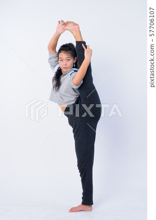 Full body shot of beautiful Asian woman stretching and ready for gym Full body shot of beautiful Asian woman stretching and ready for gym 57706107