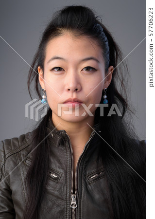 Face of beautiful Asian rebellious woman with leather jacket 57706223