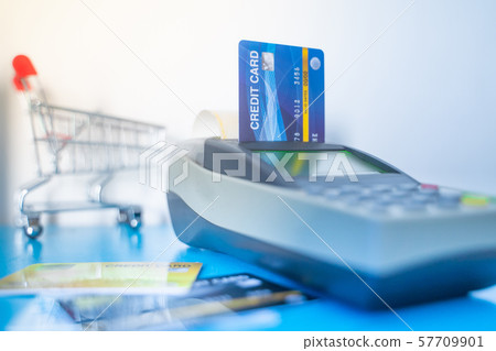 Swipe multiple credit cards in the shop. shopping 57709901