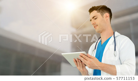 Doctor using tablet computer at the hospital. Doctor using tablet computer at the hospital. 57711153