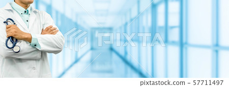 Male doctor standing in the hospital office. 57711497