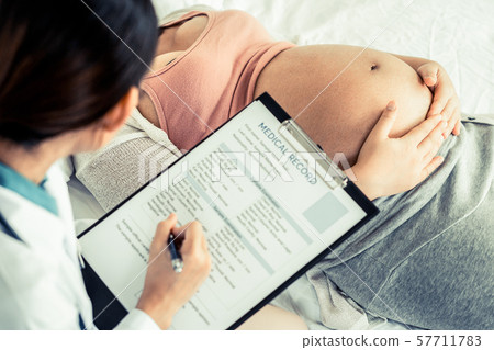 Pregnant Woman and Gynecologist Doctor at Hospital 57711783