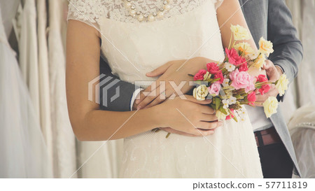 Bride and groom in wedding dress prepare ceremony. 57711819
