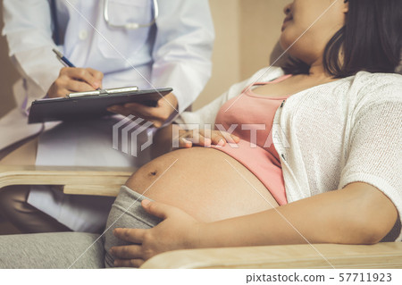 Pregnant Woman and Gynecologist Doctor at Hospital 57711923
