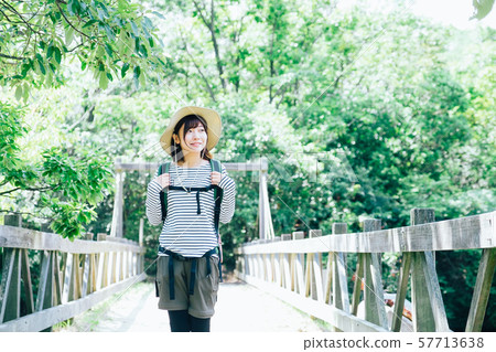 Trekking young woman Trekking young woman 57713638