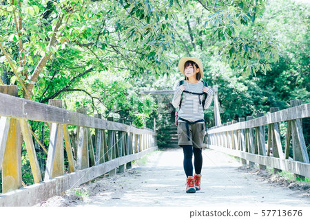 Trekking young woman 57713676