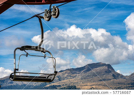 Chairlift - Elevated passenger ropeway in Italian Alps 57716087