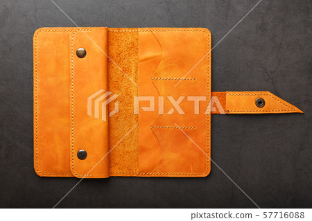 Wallet made of genuine brown nubuck leather on a 57716088