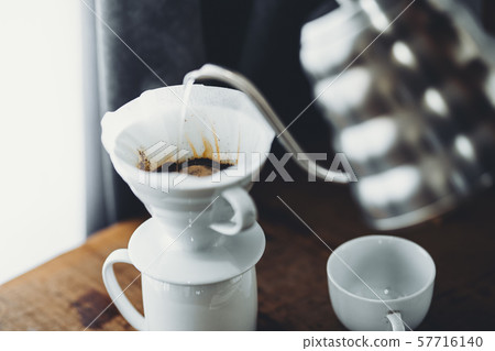 Drip coffee on the desk at home Drip coffee on the desk at home 57716140